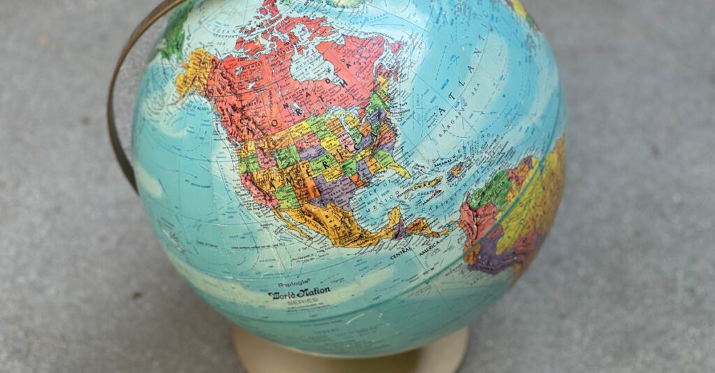 Vintage globe displaying North America and surrounding regions, ideal for geography concepts.